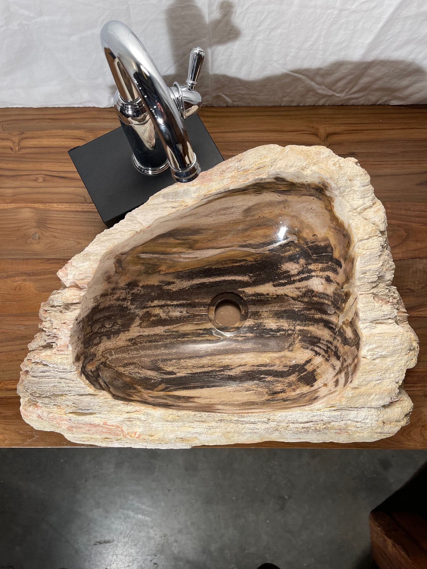 Petrified wood stone vessel sink with mixed natural colors at impact imports in boise idaho