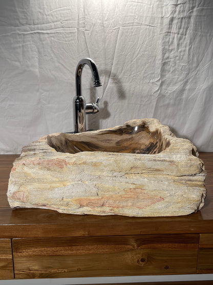 Petrified wood stone vessel sink with mixed natural colors at impact imports in boise idaho