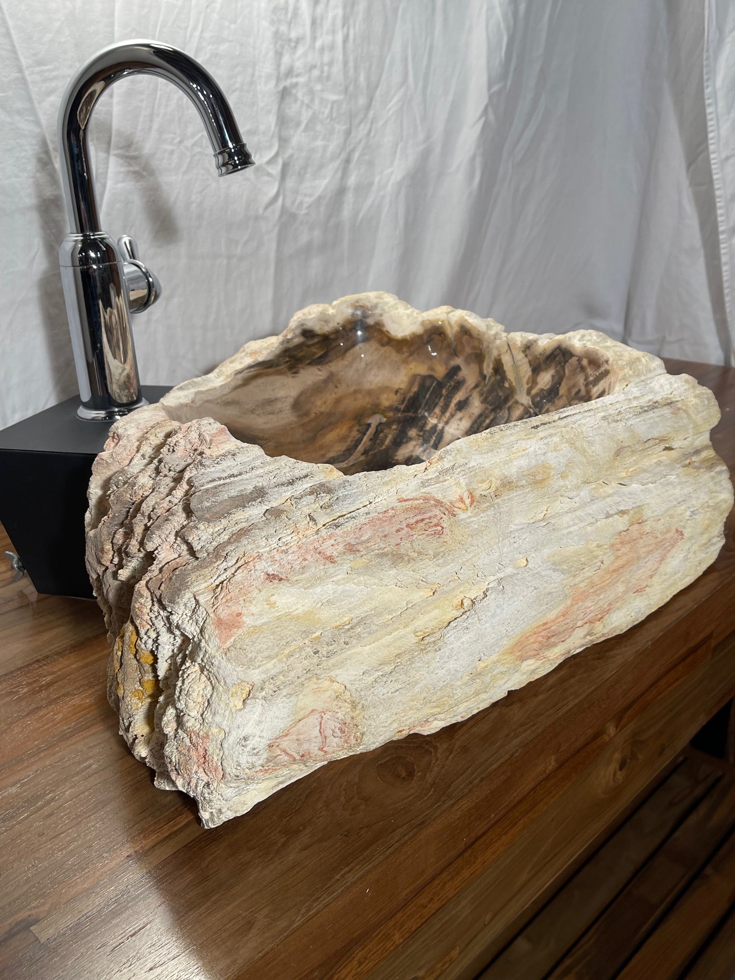 Petrified wood stone vessel sink with mixed natural colors at impact imports in boise idaho