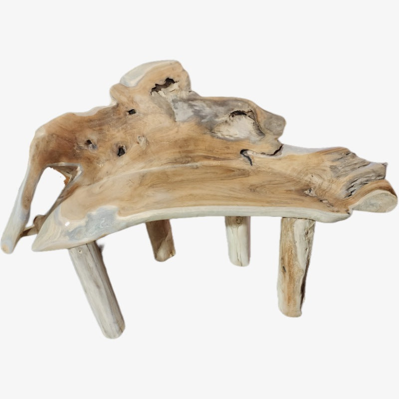 Benches and stools handcrafted from reclaimed teak tree trunks and roots