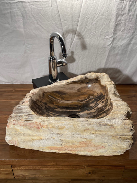 Petrified wood stone vessel sink with mixed natural colors at impact imports in boise idaho
