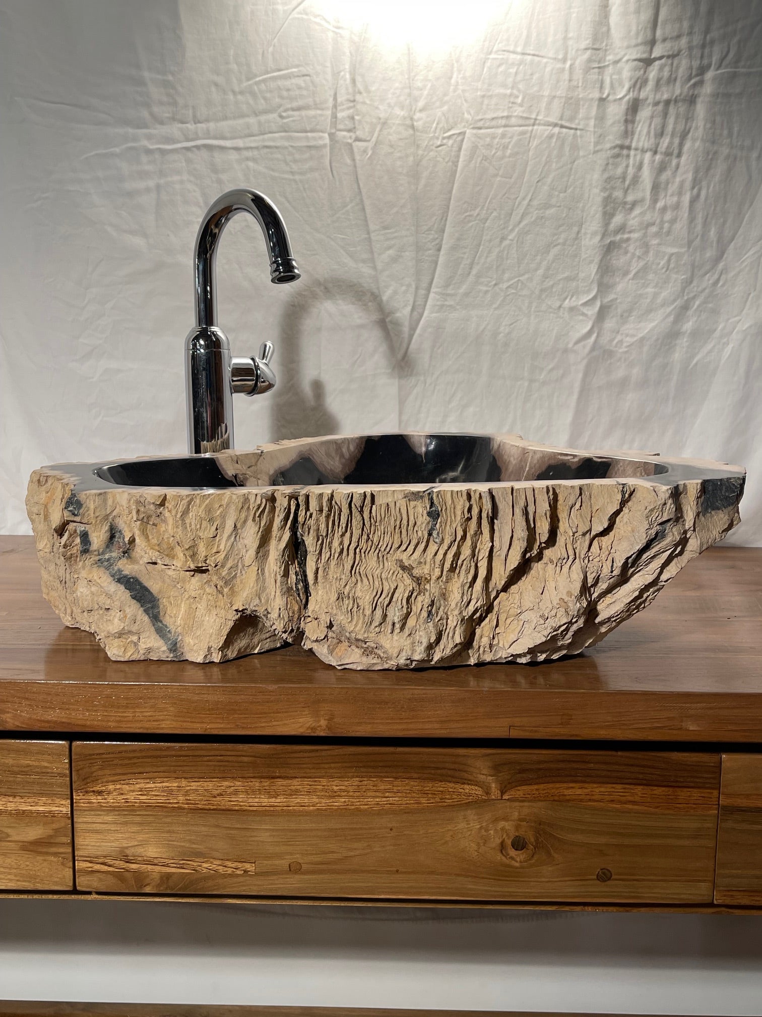 petrified wood vessel sink with black colors at impact imports in Boise Idaho