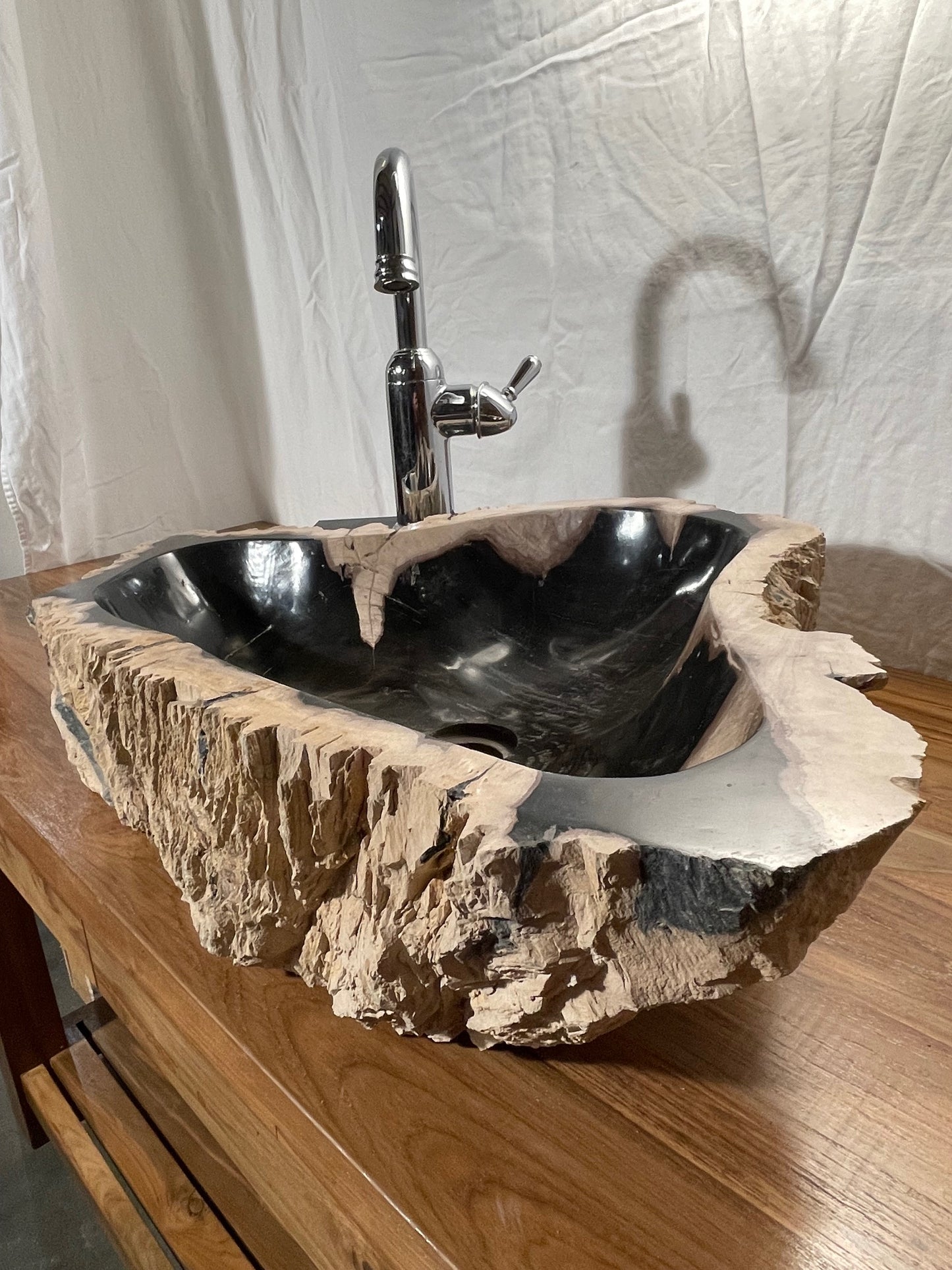 petrified wood vessel sink with black colors at impact imports in Boise Idaho