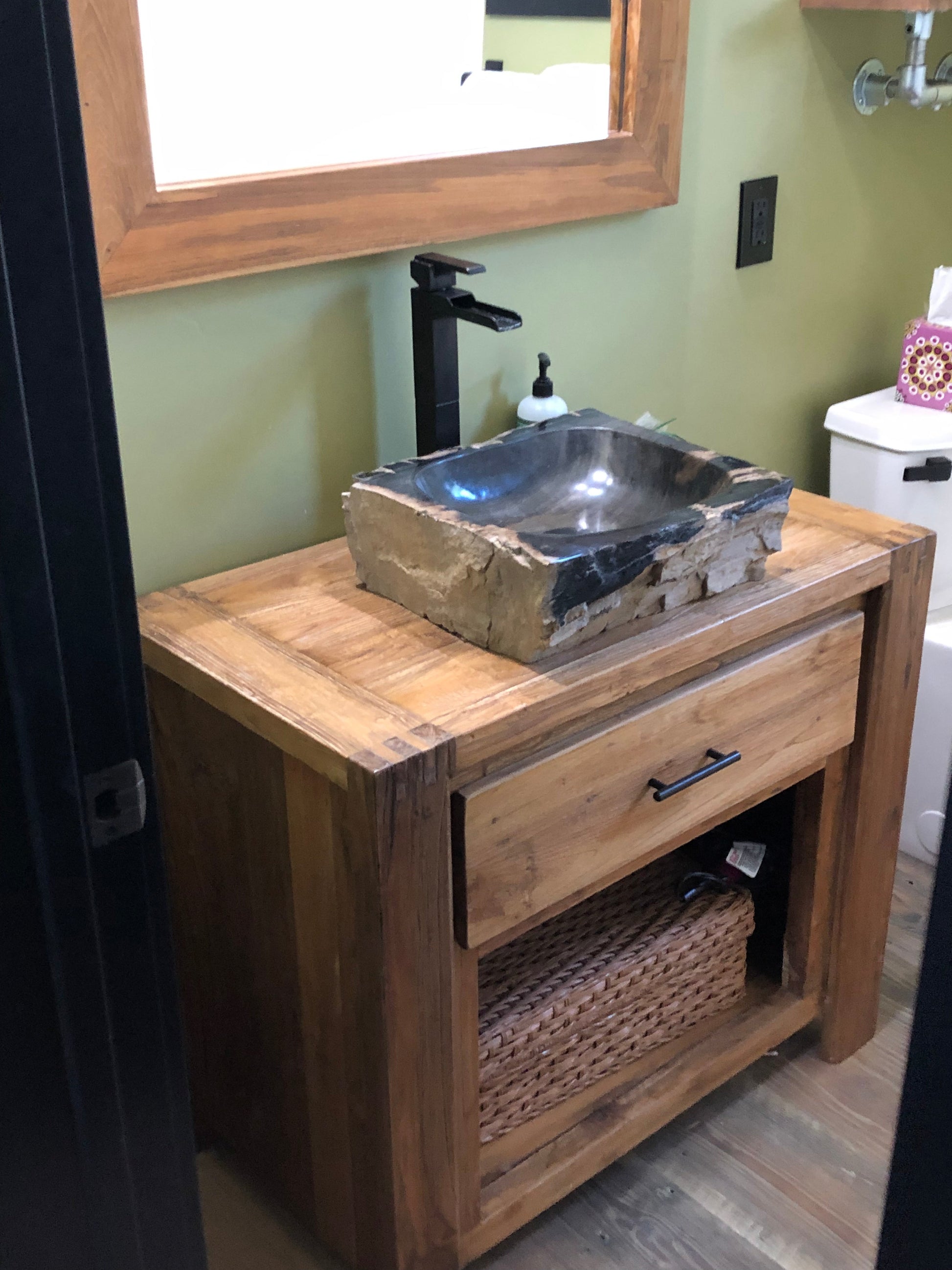 petrified wood stone vessel sink on reclaimed teak vanity installed at Ketchum Idaho