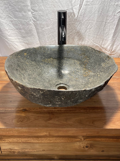 hand cut and polished river rock boulder natural stone vessel sink at impact imports in Boise, Idaho